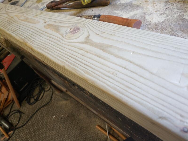 A dented, marked piece of 2x4