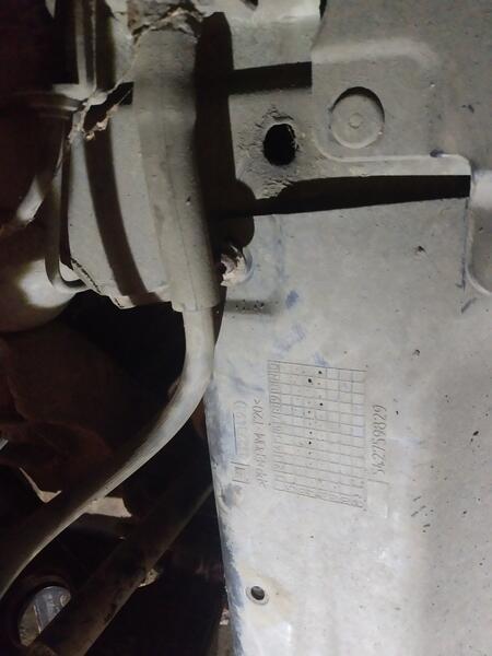 Cowling mounting bolt in wheel well