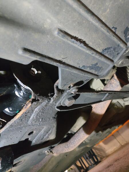 Cowling mounting bolt on underside of car